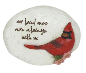 Decorative stone with a red cardinal and text on a white background
