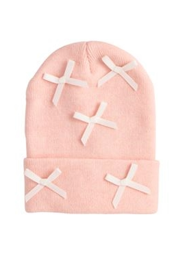 Pink beanie with white cross patterns on a white background