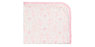 Floral patterned blanket with pink border on a white background