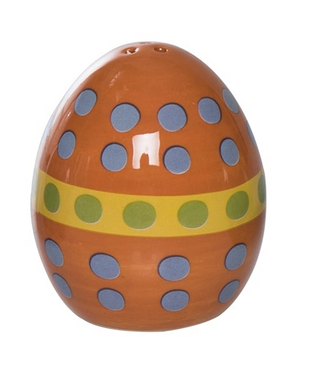 Decorative ceramic egg with polka dot pattern on a white background