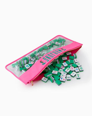 Pink carrying case with green and white tiles on a white background