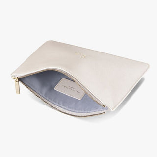 Beige pouch with gold zipper on a white background