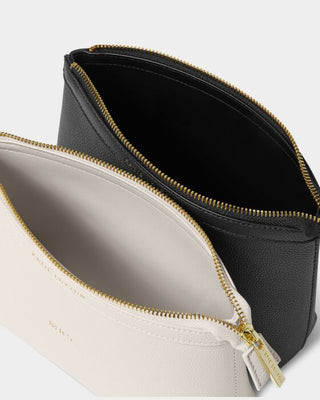 Two zipper pouches, one black and one beige, on a white background.