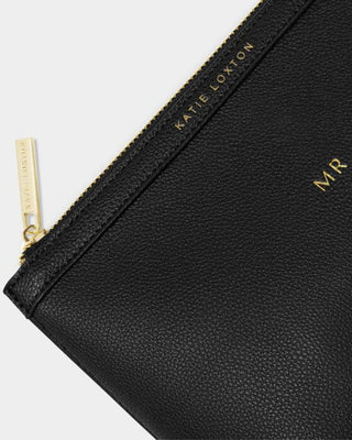 Black pouch with gold zipper and branding on a light gray background