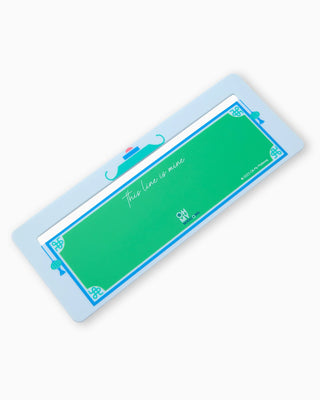 Rectangular green sign with blue border on a white background