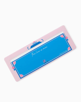 Rectangular blue sign with pink border and text on a white background