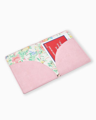 Pink card holder with floral design on a white background