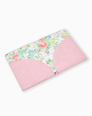 Pink baby folio with floral pattern on a white background