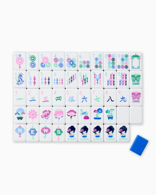 Set of colorful miniature tiles with various designs on a white background
