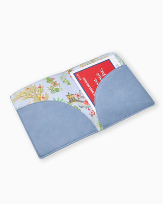 Blue fabric wallet with colorful floral design on a white background
