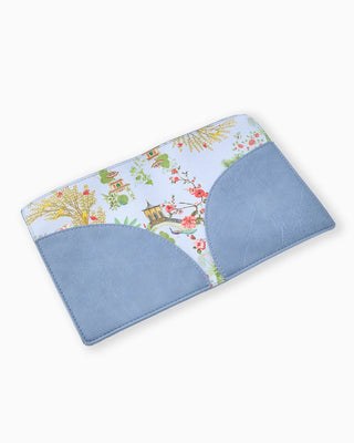 Floral-patterned fabric with blue border on a white background