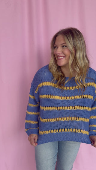 girl wearing a striped sweater 