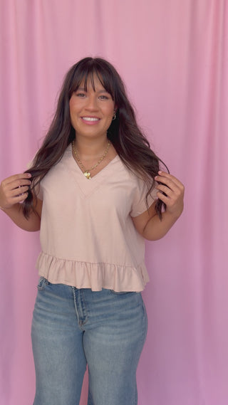 girl wearing a pink top