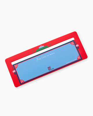 Rectangular blue mat with red border on a white background
